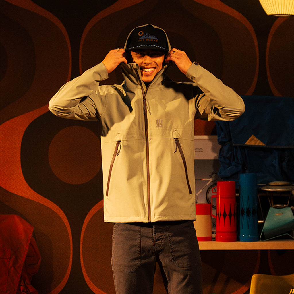 General front image of a man wearing a global jacket in "Oil Green" [Model is 5'11", wearing size medium]