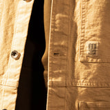 General model shot of Front view of Topo Designs Utility Jacket Undyed - Men's in "Undyed" [Model is 5'11', wearing size medium]