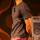 General on model image of Topo Designs Dirt Pocket Tee - Men's in "Black" [Model is 5'11", wearing size medium]