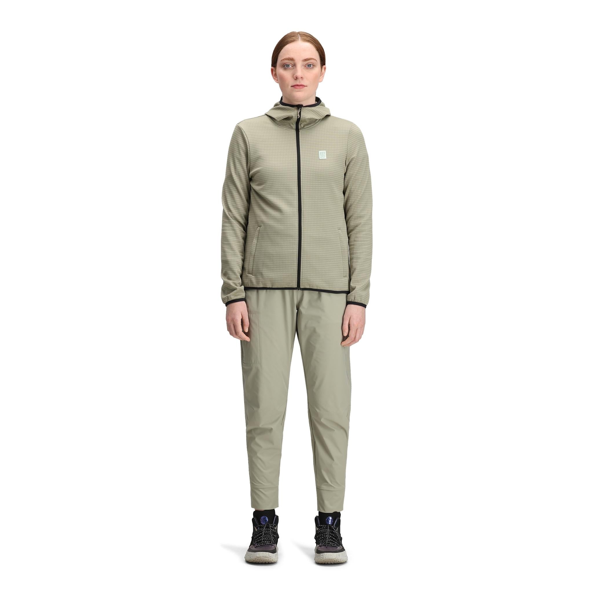 General front model shot of Topo Designs Global Midlayer Hoodie - Women's in "Dried Sage"