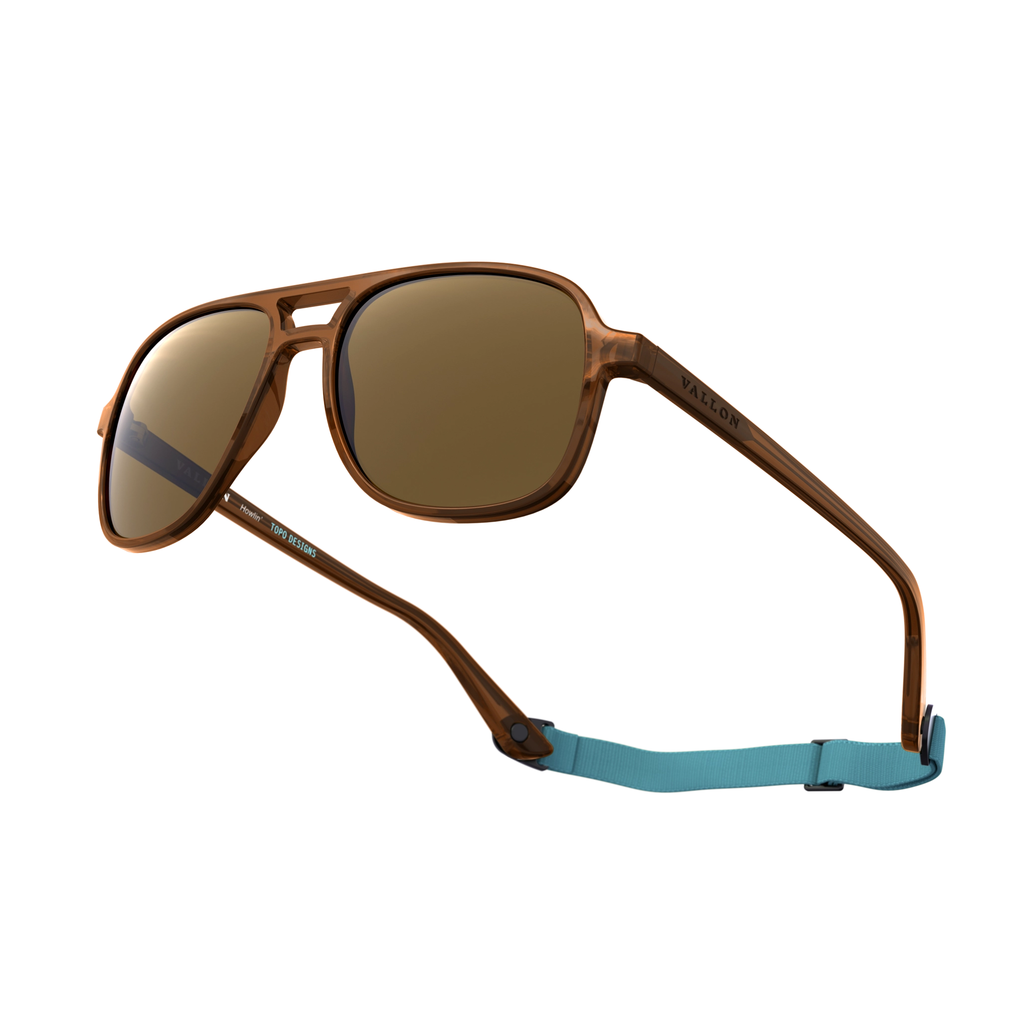 General alternate angled view of VALLON X Topo Designs sunglasses in "Brown / Brown" with sunglass arms open with strap attached.