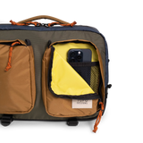 General full front product shot of the global briefcase showing use of the front zip pocket in "Olive / Dark Khaki".
