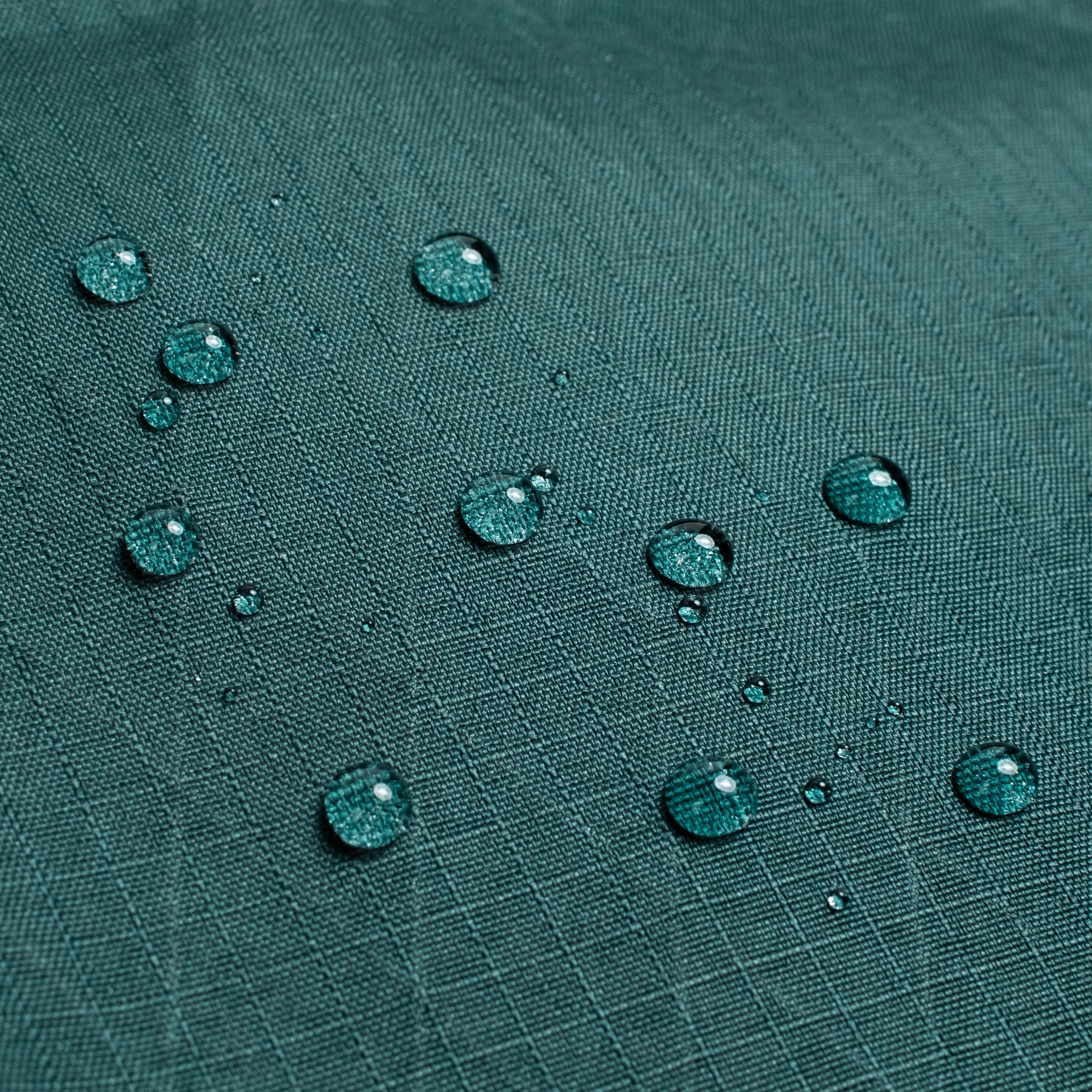 General shot of Topo Designs Global Pro Backpack showing detail shot of water droplets on waterproof material