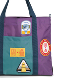 Front exterior detail image of Topo Designs x AWA Mountain Essential Tote in "Loganberry / Caribbean"