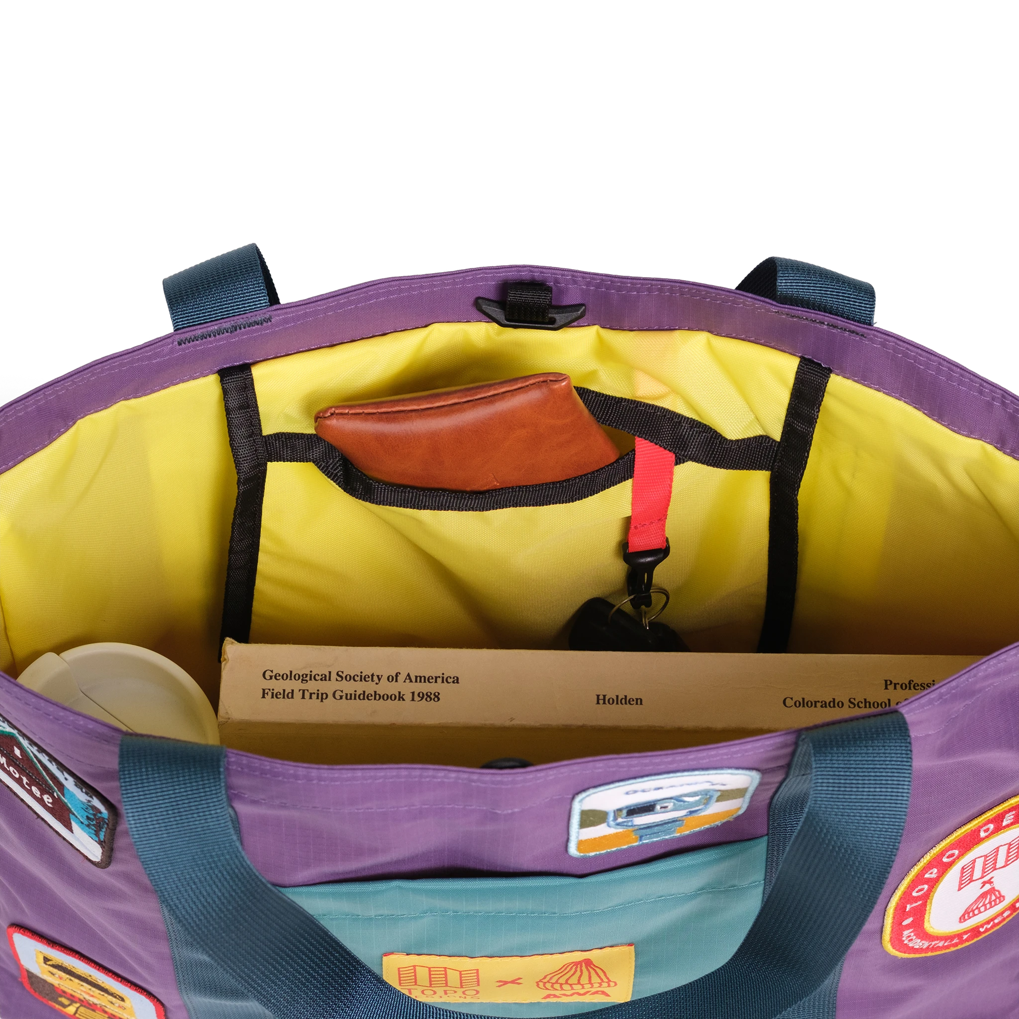 Interior detail image of Topo Designs x AWA Mountain Essential Tote in "Loganberry / Caribbean"