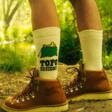 General lifestyle image of Topo Designs x TSPTR Tent Socks in "Ecru"
